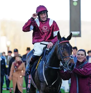  ?? ?? Sam Twistondav­ies celebrates winning The Unibet Greatwood Handicap Hurdle on I Like To Move It during day three of The November Meeting