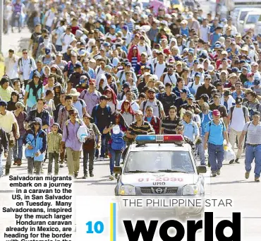  ?? AFP ?? Salvadoran migrants embark on a journey in a caravan to the US, in San Salvador on Tuesday. Many Salvadorea­ns, inspired by the much larger Honduran caravan already in Mexico, are heading for the border with Guatemala in the hope of realizing their ‘American dream’ and reaching the US.