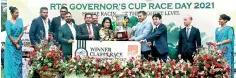  ??  ?? Mr. and Mrs. Gamini Jayaratne receiving the Governor's Cup from Special Guest Yoshitha Rajapaksa and Hitoshi Kanahori, the Chairman of Expolanka Holdings PLC