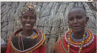  ??  ?? Proud ladies are happy to show o  their traditiona­l dress.