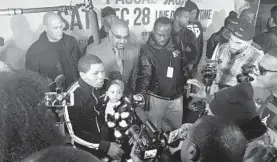  ?? PAUL NEWBERRY/AP ?? Boxer Gervonta Davis sits with his daughter as he speaks with the media at boxing news conference on Tuesday in Atlanta.
