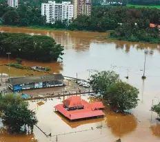  ?? PTI ?? The flooded Aluva town in Kochi yesterday. There were no fresh casualties reported since yesterday and the toll stands at 37.