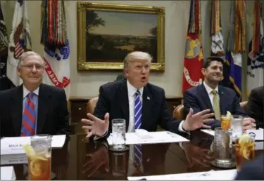  ?? EVAN VUCCI — THE ASSOCIATED PRESS FILE ?? In this file photo, President Donald Trump, flanked by Senate Majority Leader Mitch McConnell of Ky., left, and House Speaker Paul Ryan of Wis., speaks during a meeting with House and Senate leadership, in the Roosevelt Room of the White House in...