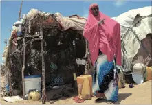  ??  ?? BATTLE: Muhubo Abdulahi was among the first refugees to settle in Dadaab in 1991. She was repatriate­d by UNHCR in March this year and now lives in this small hut in Tawfiq displaceme­nt camp in Kismayo.