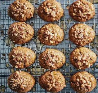  ?? Photos by Johnny Miller / New York Times ?? These classic Greek holiday cookies normally call for walnuts, but they can be topped with any type of nut.