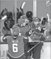  ?? Isaac Brekken Getty Images ?? GOLDEN KNIGHTS’ James Neal, second from right, is congratula­ted after scoring in second period.