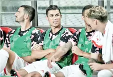  ??  ?? Cristiano Ronaldo (C) stayed on the bench during Juventus's exhibition game in Seoul last week. - AFP photo