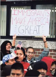  ?? Hearst Connecticu­t Media file photo ?? Gabby Perez, 17, of Danbury, holds a “Immigrants Make America Great” sign at a Day Without Immigrants rally at Danbury City Hall on Feb. 16, 2017.