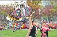  ?? PHOTOS BY YUAN ZHOU, DA WEI, LI WENMING AND XU CONGJUN / FOR CHINA DAILY ?? Almost every household was involved in making kites in the old days, but now the craft has been verging on extinction amid China’s modernizat­ion.