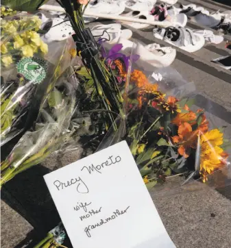  ?? Michael Macor / The Chronicle 2014 ?? A memorial marks the spot where a city employee was killed outside City Hall in November.