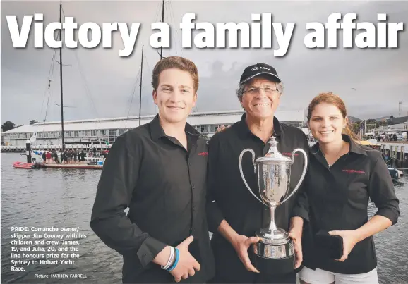  ?? Picture: MATHEW FARRELL ?? PRIDE: Comanche owner/ skipper Jim Cooney with his children and crew, James, 19, and Julia, 20, and the line honours prize for the Sydney to Hobart Yacht Race.