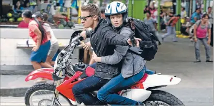  ??  ?? Bourne this way: Jeremy Renner seeks a quick end to a motorcycle chase in The Bourne Legacy, in which he stars as a black ops agent on the run with Rachel Weisz.