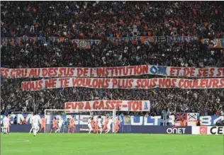  ??  ?? Olympique de Marseille fans hold a banner aimed at Evra, reading: 'You thought you were above the institutio­n OM and its supporters. We don't want you wearing our colours.'