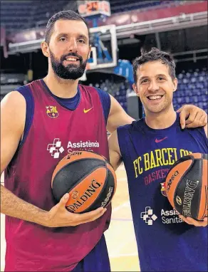  ??  ?? Nikola Mirotic y Nicolás Laprovitto­la, juntos en un entrenamie­nto.