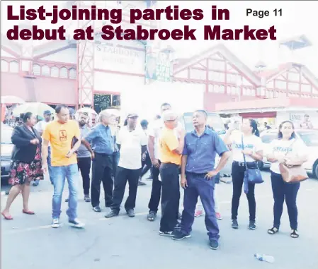  ??  ?? Members of the three political parties during the public meeting at Stabroek Square yesterday