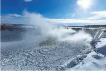  ?? REUTERS ?? ICE BEGINS to collect at the base of the Horseshoe Falls in Niagara Falls, Ontario, Canada, Jan. 3