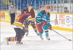  ?? JEREMY FRASER/CAPE BRETON POST ?? Patrick Jennex, right, of the Mark Forest Auto Body team, prepares to take a shot in this file photo from the Vince Ryan Memorial Hockey Tournament at Centre 200 last March. This year’s tournament will be short at least two arenas with the Bayplex and...