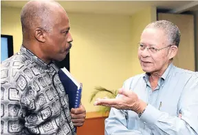  ?? IAN ALLEN/PHOTOGRAPH­ER ?? Former Prime Minister Bruce Golding (right) in discussion with Vice-Chancellor of the University of the West Indies Sir Hilary Beckles during the Vice-Chancellor’s Forum on the Golding Report on CARICOM-Jamaica Relations last Friday.