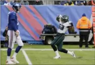  ?? SETH WENIG — THE ASSOCIATED PRESS ?? Even though he showed Eli Manning, left, his version of a celebratio­n dance Sunday, Eagles linebacker Nigel Bradham, right, referenced the defense’s performanc­e against the Giants and said, ‘we want to get better.’