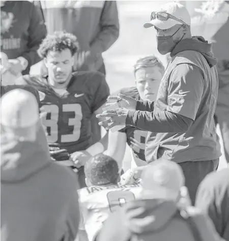  ?? HINTON/AP MATTHEW ?? National Team head coach Brian Flores (Miami Dolphins) talks to players Thursday during the National Team practice for the Senior Bowl in Mobile, Ala.