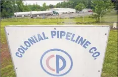  ?? Chris Carlson / Associated Press ?? Tanker trucks are parked near the entrance of the Colonial Pipeline Company on Wednesday in Charlotte, N.C.