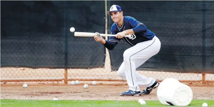  ?? — THE ASSOCIATED PRESS FILES ?? Non-roster invitee Chris Young, 38, goes through a bunting drill last week during the San Diego Padres’ spring training camp in Peoria, Ariz.