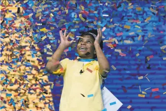  ?? John Raoux / Associated Press ?? Zaila Avantgarde, 14, a Guinness world record holder for her basketball skills, celebrates her victory Thursday night in the finals of the 2021 Scripps National Spelling Bee at Disney World.