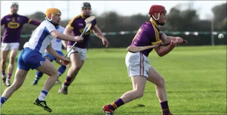  ??  ?? Anthony Roche in the process of delivering the ball towards the Wexford forward line.