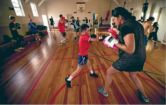  ?? PHOTO: DAVID UNWIN/FAIRFAX NZ ?? Tyler Green, 11, trains with coach Lisa Wamoana at the Palmerston North Boxing Club. The club is on the hunt for a new location because they have outgrown the hall they’re in now