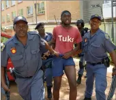  ?? PICTURE: MASI LOSI ?? IN CUSTODY: Police officers arrest a University of Pretoria student during a demonstrat­ion against the change of policy of the university and demands for scrapping of Afrikaans as medium of instructio­n.