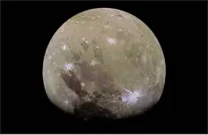  ?? NASA/JPL/JUNO VIA THE NEW YORK TIMES ?? Ganymede, the largest of Jupiter’s moons, captured by the Juno spacecraft.