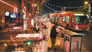  ?? Robert Gauthier Los Angeles Times ?? THE PATIO at Rocco’s WeHo is open just a few hours more before Los Angeles County’s latest COVID- 19 curfew takes effect at 10 p. m. Wednesday. “It’s a sad situation for everyone,” one diner in Long Beach said.