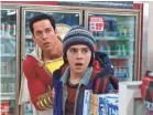  ?? DC COMICS ?? Supersized Billy (Zachary Levi, left) and Freddy (Jack Dylan Grazer) run into robbers in “Shazam!”