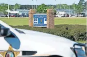  ?? [SEAN RAYFORD/THE ASSOCIATED PRESS] ?? A police vehicle sits outside the Lee Correction­al Institutio­n on Monday in Bishopvill­e, S.C. Multiple inmates were killed and others seriously injured amid fighting between prisoners inside the maximum security prison in South Carolina.