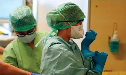  ??  ?? The Covid-19 pandemic has put pressure on supplies of protective medical equipment. Photograph: Kenzo Tribouilla­rd/AFP via Getty Images