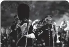  ??  ?? U.S. Army soldiers with The Old Guard participat­e in a wreath-laying ceremony at Arlington National Cemetery.