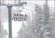  ?? COURTESY OF HEAVENLY MOUNTAIN ?? Skiers ride the lift at Heavenly Mountain Resort on Thursday. Heavenly reports seven inches of new snow since Thursday.