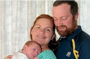  ??  ?? Jaimee Edwards, with 3-week-old Alex and husband Liam, who was killed in a helicopter crash a week after this photo was taken.