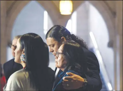  ?? CP PHOTO ?? Sheldon Wuttunee puts his arm around Debbie Baptiste, mother of Colten Boushie, while she pauses as the family speaks to reporters in the Foyer of the House of Commons.