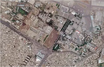  ?? — AP ?? This satellite photo provided by Planet Labs Inc shows vehicles trying to reach the civilian side of Kabul Internatio­nal Airport, also known as Hamid Karzai Internatio­nal Airport, on Wednesday. The Pentagon said Tuesday that US commanders are communicat­ing with the Taliban as they work to evacuate thousands of people through the airport.