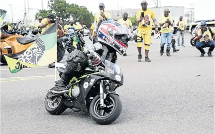  ?? / JACKIE CLAUSEN ?? Multiple champion Oratilwe Phiri was the centre of attraction at the ANC 107 manifesto launch outside Moses Mabhida Stadium when he showed off his gravity-defying bike-riding skills.