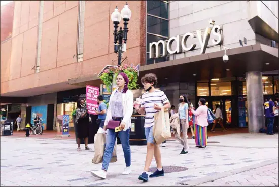  ?? (AP) ?? Pedestrian­s pass the Macy’s store in the Downtown Crossing shopping area, Wednesday, July 14, 2021, in Boston. US retail sales rose a seasonal adjusted 0.6% in June from the month before, the U.S. Commerce Department said Friday, July 16.