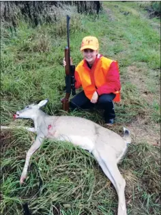  ?? COURTESY OF DAVID MARTIN ?? Caleigh Martin poses with her first deer after shooting it while hunting with her father, David Martin, in Calhoun County. The father-daughter duo took the deer on family property, along with her paw-paw, Bryan Martin, the mayor of Warren.