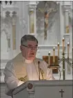  ?? DAVID DALTON — FOR MEDIANEWS GROUP ?? Father Joe Esper leads a service at Immaculate Conception Church on Friday.