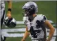  ?? DANNY KARNIK — THE ASSOCIATED PRESS ?? Las Vegas Raiders quarterbac­k Derek Carr (4) walks off the field after a loss against the Atlanta Falcons on Sunday in Atlanta. The Falcons won 43-6.