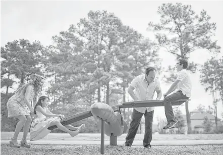  ?? Marie D. De Jesús photos / Houston Chronicle ?? Perla Soto and her husband, David Medina, play with their children Diego, 11, and Paola, 9, at the playground in front of their home in The Woodlands. The couple moved to The Woodlands seeking safety, good educations for their kids and business...