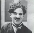  ?? ?? English film actor and director Charlie Chaplin (1889 - 1977) between takes during the filming of the 1917 silent film “Easy Street.”