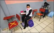  ?? (AP/Marco Ugarte) ?? Students sit socially distanced Monday at the Republic of Argentina secondary school.