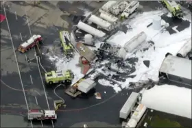  ?? WFXT BOSTON 25 NEWS VIA AP ?? In this aerial image taken from video, emergency crews respond to where a World War II-era bomber B-17 plane crashed at Bradley Internatio­nal Airport in Windsor Locks, Conn., Wednesday.