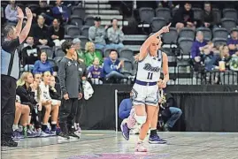  ?? ?? Drake’s Megan Meyer reacts after draining a 3-pointer against UNI in the MVC Tournament semifinal at Vibrant Arena in Moline, Ill.
